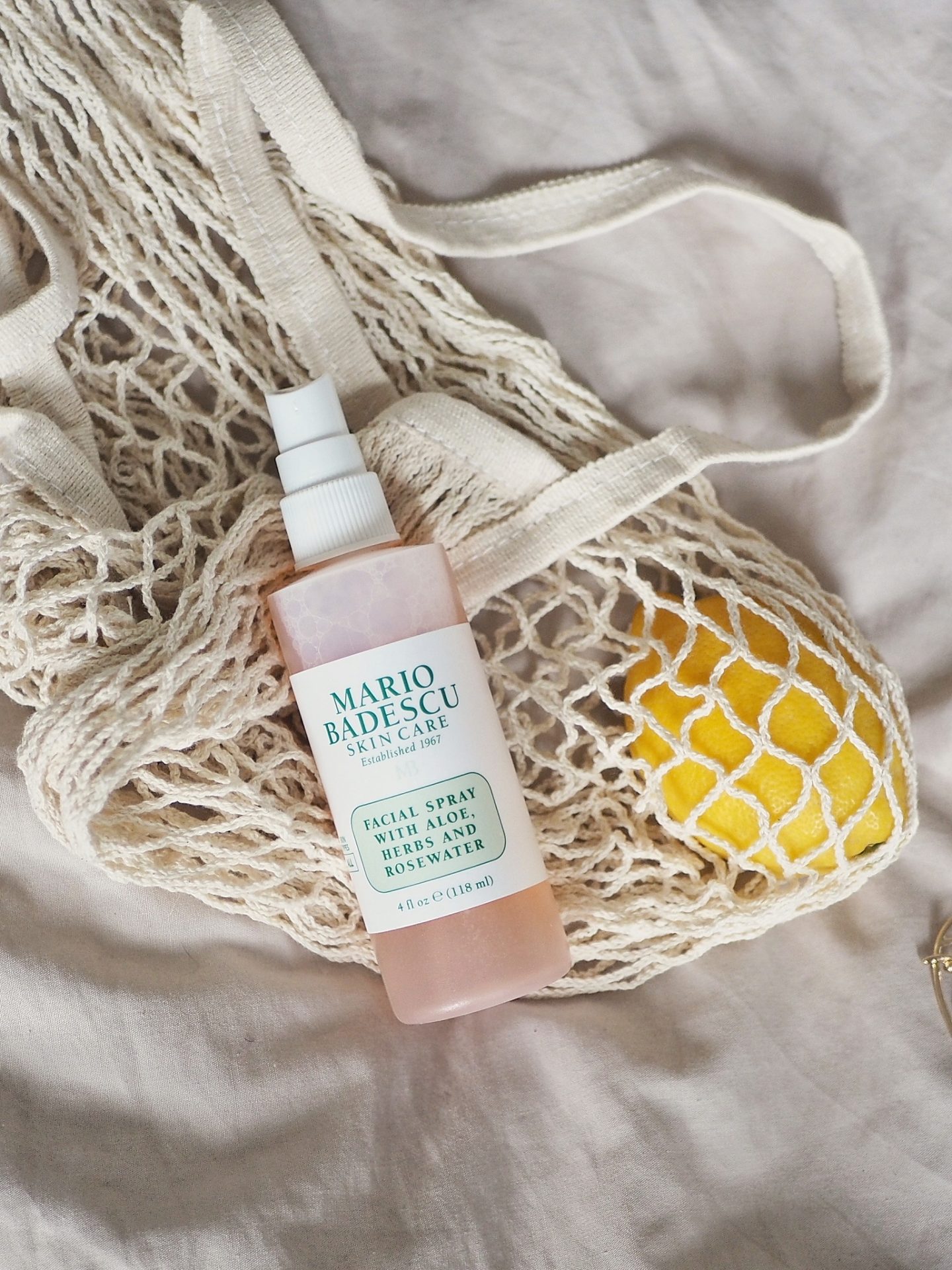 flat lay photo with the cult beauty classic Mario Badescu Facial Spray 