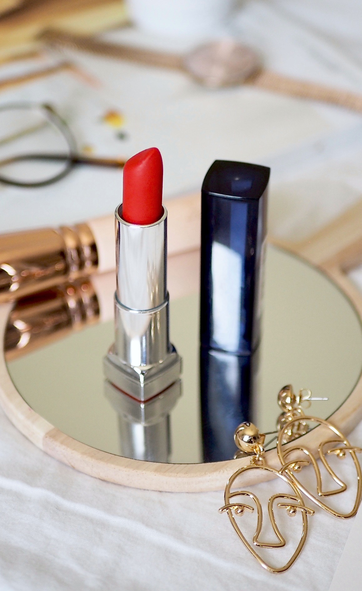 Maybelline Orange Danger is a bold and bright coral red that is comfortable on the lips with a really nice formula that feels hydrating...www.ayelined.com