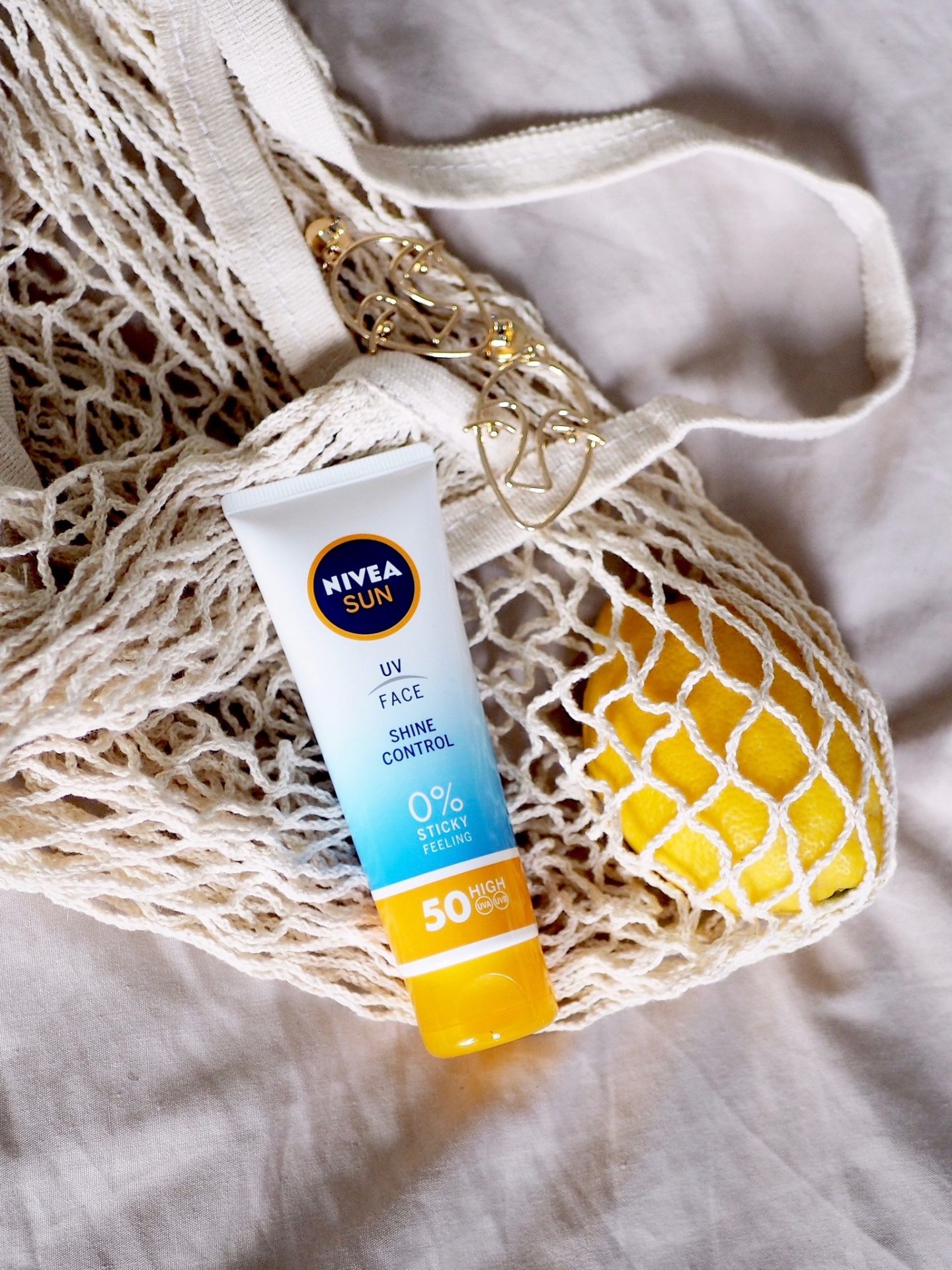flatlay photo with Nivea SUn UV Face 50 SPF, one of the best affordable sunscreens