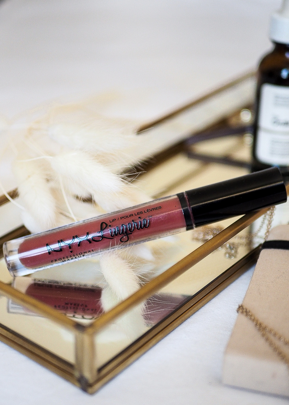 close up of nyx lip lingerie sitting on gold tray