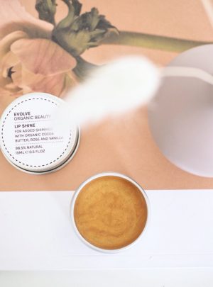 Evolve organic lip balm review- with gold sparkles and can be used as a subtle natural highlighter