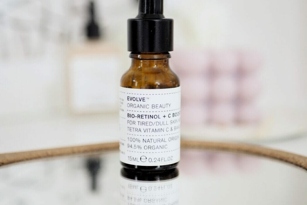 Evolve beauty facial oil sitting on a mirror, part of a review of best facial oils for glowing skin